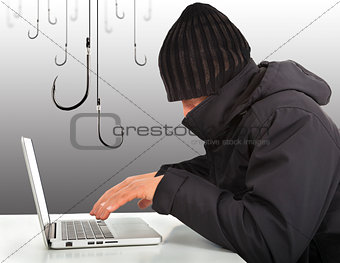  hacker working  with a laptop computer and hooks