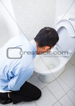 Young man drunk or sick vomiting