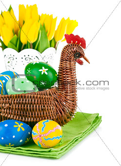 easter eggs in basket with flowers