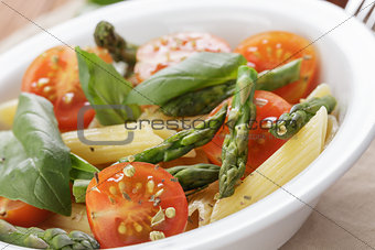 italian pasta penne with tomatoes and asparagus