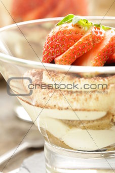 Italian dessert tiramisu decorated with strawberries
