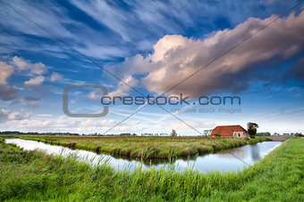 charming farmhouse and dramatic sky