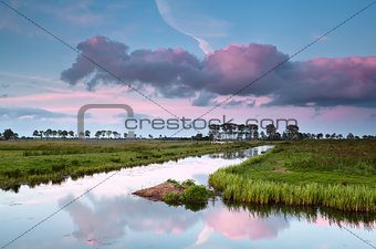 pink sunset over water canal