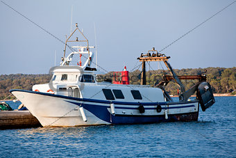 fishing boat in summer outside in sea at harbour