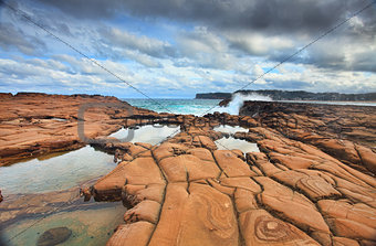 Waves splash on magnificent rock formations