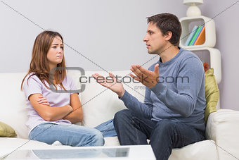 Angry couple having an argument at home