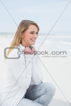 Cmiling casual young woman relaxing at beach