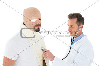 Doctor auscultating patient tied up in bandage with stethoscope