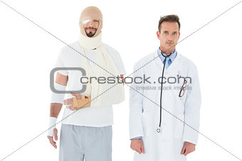 Portrait of a doctor with patient tied up in bandage