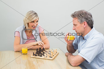 Concentrated couple playing chess
