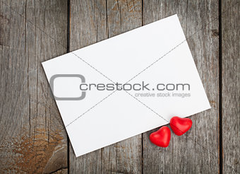 Valentine's day blank gift card and red candy hearts