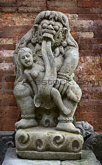 Antique statue of child-eating Rangda. Indonesia, Bali.