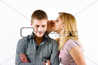young woman whispering a secret