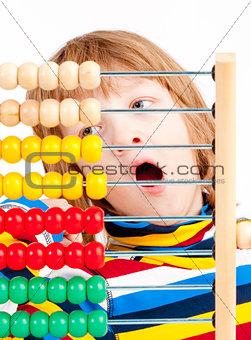 Child Counting on Colorful Wooden Abacus 