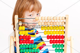 Boy Looking at Colorful Wooden Abacus Thinking 
