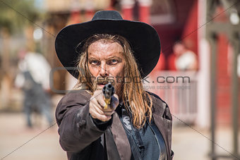 Cowboy Points Gun at You