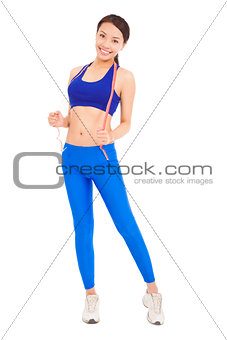 Cheerful woman in fitness wear with tape