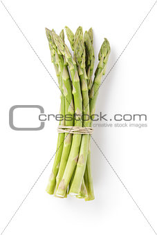 uncooked green asparagus tied with twine from above