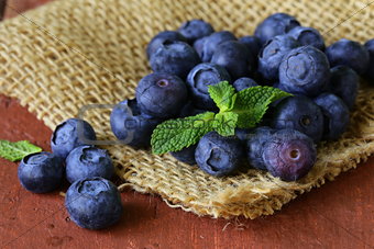 fresh organic ripe blueberries on a wooden table
