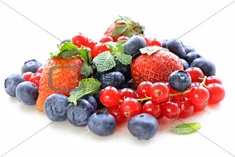 various berries - strawberry, currant, blueberry on white background