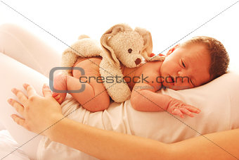 one cute little newborn baby lying on his mom