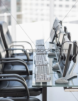 Chairs, computers and headset in modern office