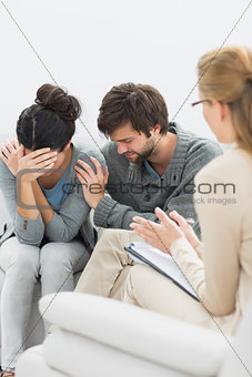 Displeased couple in meeting with a financial adviser