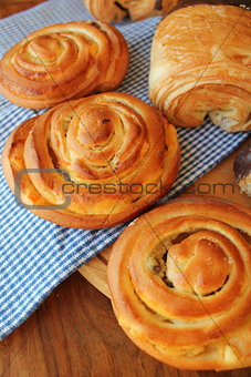 Fresh buns on wooden table