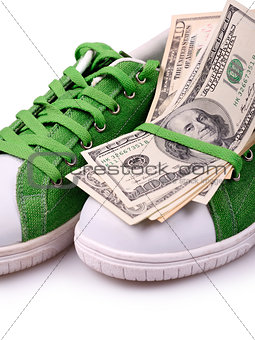 Paper Currency on a green shoes