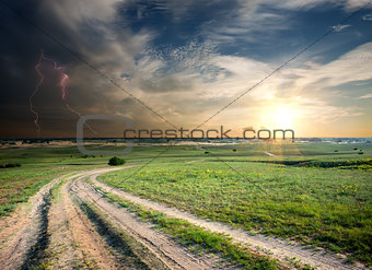 Storm over the road in field