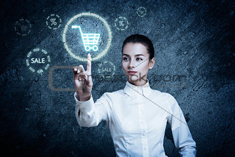 Woman Pointing at Glowing Shopping Cart Icon
