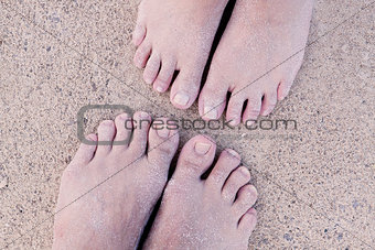 barefoot in the sand in summer holidays relaxing