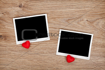 Two photo frames and small red candy hearts