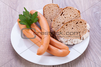tasty sausages frankfurter with grain bread 