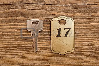 Close up shot of hotel room key shot on wooden background