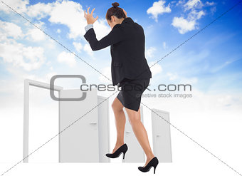 Composite image of businesswoman gesturing