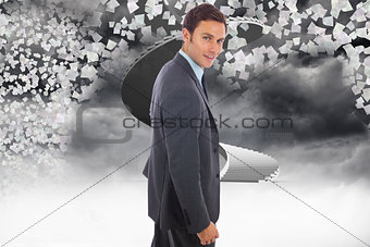 Composite image of cheerful handsome businessman standing