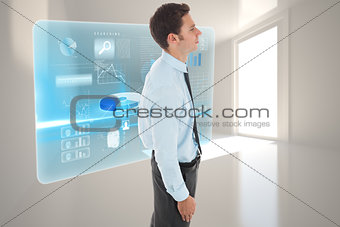 Composite image of serious businessman standing