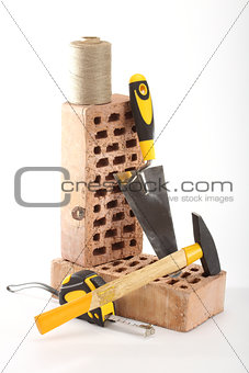 Bricks, trowel and hammer