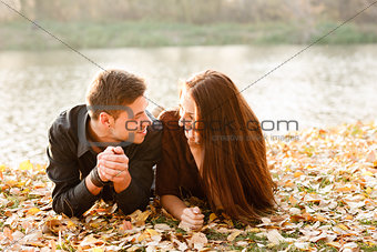young couple lying down talking