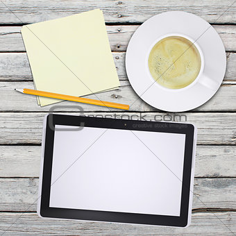 Tablet pc and coffee cup
