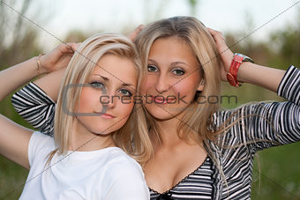 Closeup portrait of two attractive young women