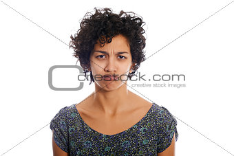 portrait of sulky hispanic girl puffing