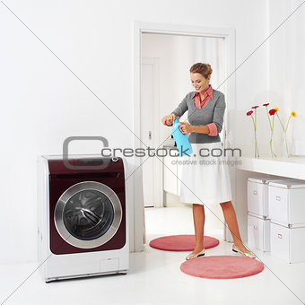 woman doing a housework holding presoak 