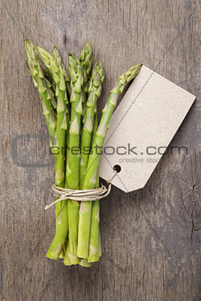 bunch of green asparagus tied with twine