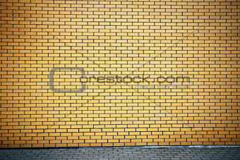 Vibrant yellow brick wall