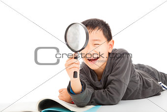 happy kid with magnifying glass and book