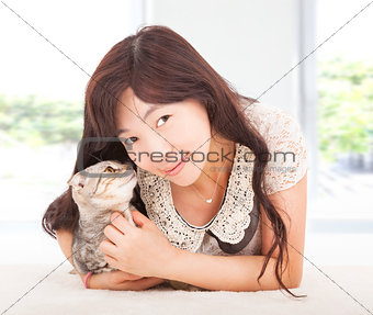 pretty woman smiling and hug her cat