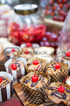 Fresh cherry-topped cupcakes and other snacks