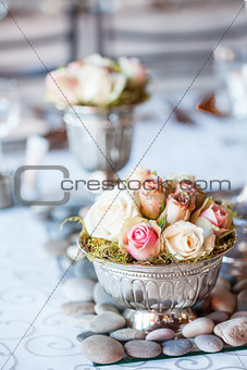 Beautiful bouquet of roses at wedding reception